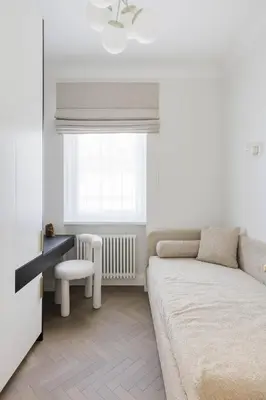 a living room with a couch and a window at SongInn Deco Apartment in Kaunas