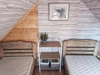 a tiny house with a table and two chairs at Cozy stay in village
