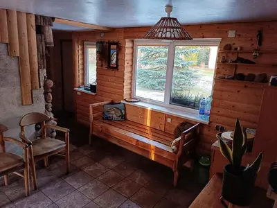 a living room with a bench and a window at Cozy stay in village
