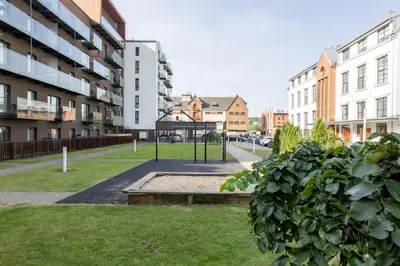 a park in the middle of a city with buildings at Vincent Sunlight Stay - Near Clinic, Arena and Stadium in Kaunas