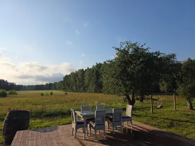 a table and chairs sitting on a brick patio at Friend's homestead