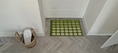 a basket of balls on a floor next to a door at Next door airport apartment in Karmėlava