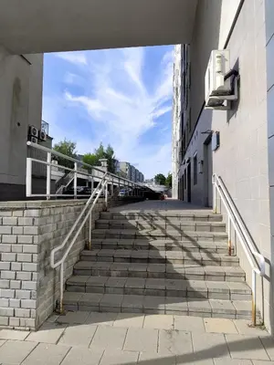 a set of stairs leading up to a building at Jaukūs apartamentai in Vilnius