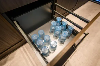 a bunch of water bottles sitting on a shelf at Jacuzzi Cinema Japandi 2 in Kaunas