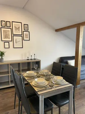 a dining room with a table and chairs at newTown 1 in Kaunas