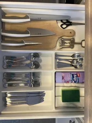 a drawer filled with knives and other kitchen utensils at newTown 1 in Kaunas
