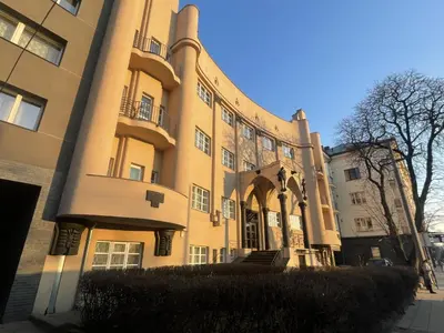 a large building with a staircase in front of it at newTown 1 in Kaunas