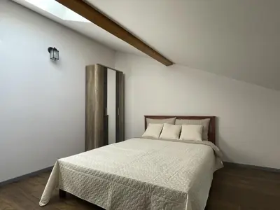 a bedroom with a bed in a white room at newTown 1 in Kaunas