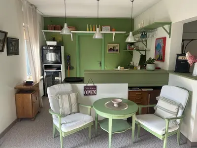 a living room with a table and two chairs at Saga studio in the center of Pasvalys in Pasvalys