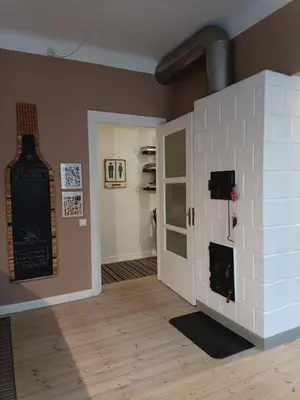 a room with a brick wall and a fireplace at Kaunas Inn Colors in Kaunas