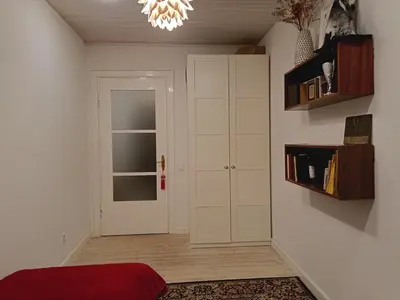a room with a white door and a window at Kaunas Inn Colors in Kaunas