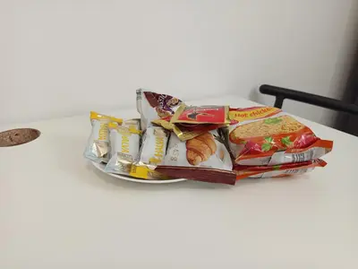 a pile of food on a plate on a table at CenterStudioFlat in Vilnius