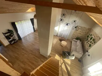an overhead view of a living room with a couch at LilHouse loftas Šiauliuose in Šiauliai