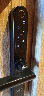 a remote control is attached to a wooden door at Platforma2b one in Šiauliai