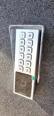 a remote control in a plastic case sitting on the floor at Platforma2b one in Šiauliai