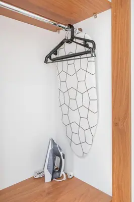 a wire mesh bag hanging on a wall at NG Charm in Old Town Apt w-Terrace & Netflix in Vilnius
