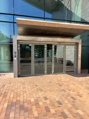 an entrance to a building with glass doors at Vilnius SkyView 19 in Vilnius