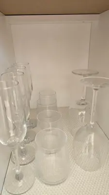 a group of wine glasses sitting on a counter at Santakos apartmentai in Kaunas
