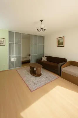 a living room with a couch and a coffee table at Home in Santariskes in Vilnius