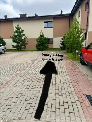 a shadow of an airplane on a driveway at Modern apartment with balcony in Užliedžiai