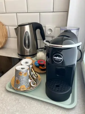 a coffee maker on a tray on a kitchen counter at DvaroStudio jaukus butas centre self-check-in in Šiauliai