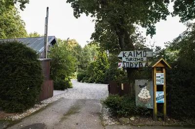 a sign that says kaitlin imperial nursery next to a driveway at Kaimo turizmo sodyba Kukarskė in Kiduliai