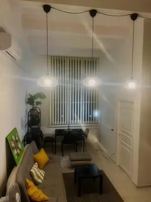 a living room with a couch and a table at Tech City Apartments, Nr Vilnius Old Town in Vilnius