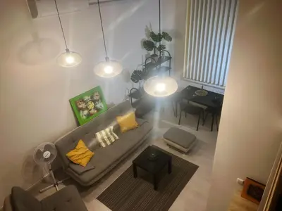 an overhead view of a living room with a couch and a table at Tech City Apartments, Nr Vilnius Old Town in Vilnius