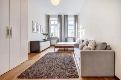 a living room with a couch and a table at Domillion Quiet 2bdr apt w panorama & balcony B83 in Vilnius