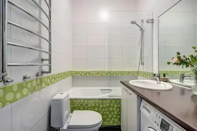 a bathroom with a toilet and a sink at Domillion Quiet 2bdr apt w panorama & balcony B83 in Vilnius