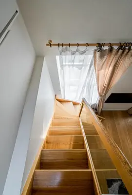 a staircase in a house with a window at Domillion 3bdr Huge Town Hall Luxury Apt AC D3948 in Vilnius