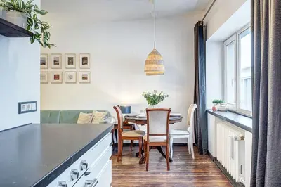a kitchen and dining room with a table and chairs at Domillion 1bdr Dominikonu str apt Do333 in Vilnius