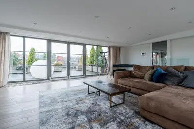 a living room with a couch and a coffee table at Domillion Amazing 3bdr Penthouse with Terrace MZ28 in Vilnius