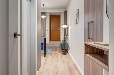 a hallway with a door leading to a hallway with a hallway at Domillion 1bdr Modern Old Town Retreat So1a in Vilnius