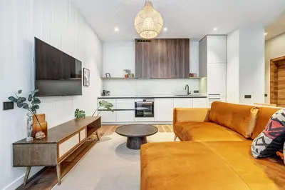 a living room with a couch and a table at Domillion 2bdr Modern Old Town Retreat So1d in Vilnius