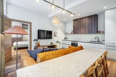 a living room with a couch and a table at Domillion 5bdr Modern Urban Fourplex So1F in Vilnius