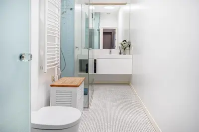 a bathroom with a toilet and a sink at Domillion 2bdr Bright&Central apt PA227 in Vilnius