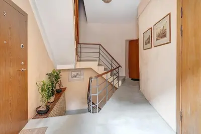 a staircase in a room with a stair case at Domillion Cozy 2bdr apt on Stikliu str S43 in Vilnius