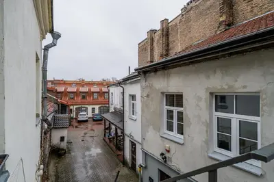 a view of an alley in a city with buildings at Domillion 1bdr unique and warm Old Town apt Tr41 in Vilnius