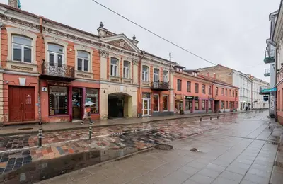 an empty street in a city with many buildings at Domillion 1bdr unique and warm Old Town apt Tr41 in Vilnius