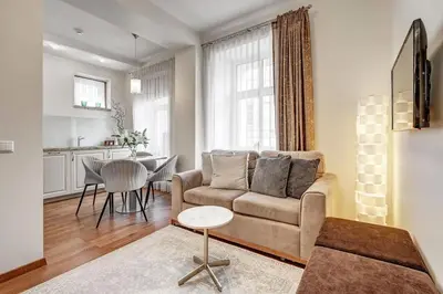 a living room with a couch and a table at Domillion New Old Town Amber 1bdr Z1B4 in Vilnius