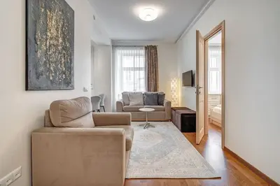 a living room with a couch and a chair at Domillion New Old Town Amber 1bdr Z1B4 in Vilnius