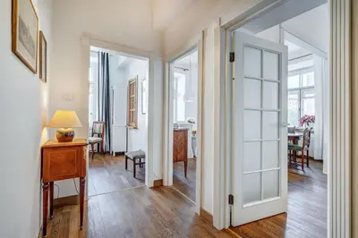 a hallway with a door leading to a dining room at Domillion 2bdr Vilnius str antique apt Vl476 in Vilnius