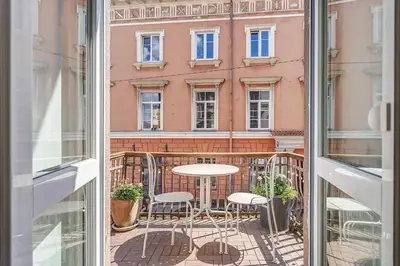 a view of a balcony with a table and chairs at Domillion 2bdr Vilnius str antique apt Vl476 in Vilnius