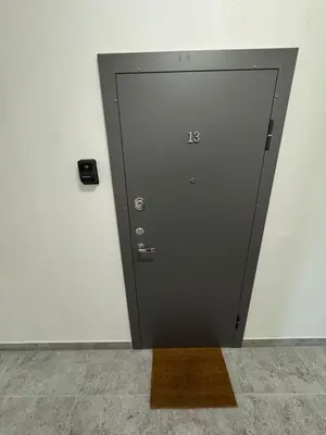 a elevator door with the number on it at 13 New Airport Apartment in VNO