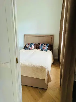 a bedroom with a bed with two pillows on it at Old Town Riverside Haven in Vilnius