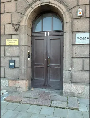 a large wooden door in a stone building at Old Town Riverside Haven in Vilnius