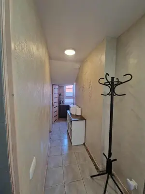 a hallway with a room with a altar in it at Vilmos studija in Šiauliai