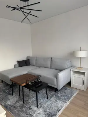 a living room with a couch and a table at The Hidden Gem Rukla in Rukla