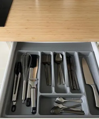a tray filled with utensils in a sink at The Hidden Gem Rukla in Rukla